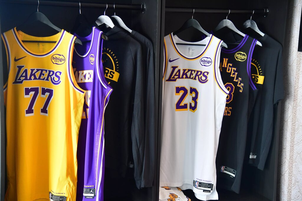 Sep 29, 2025; Los Angeles, CA, USA; Jerseys of Los Angeles Lakers guard Luka Doncic (77) and LeBron James (23) pictured during media day at UCLA Health Training Center. Mandatory Credit: Gary A. Vasquez-Imagn Images