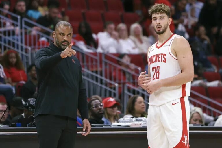 Oct 6, 2025; Houston, Texas, USA; Houston Rockets Head Coach Ime Udoka and center Alperen Sengun (28) react during the game against the Atlanta Hawks at Toyota Center. Mandatory Credit: Troy Taormina-Imagn Images