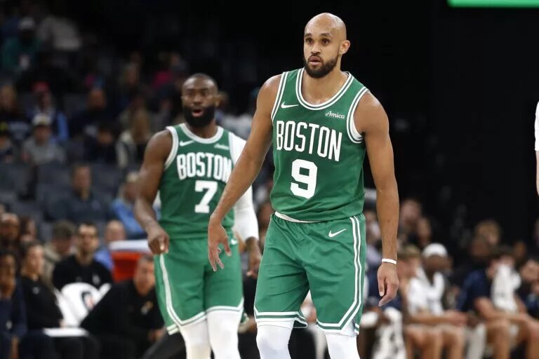 Boston Celtics guard Derrick White in front of teammate Jaylen Brown