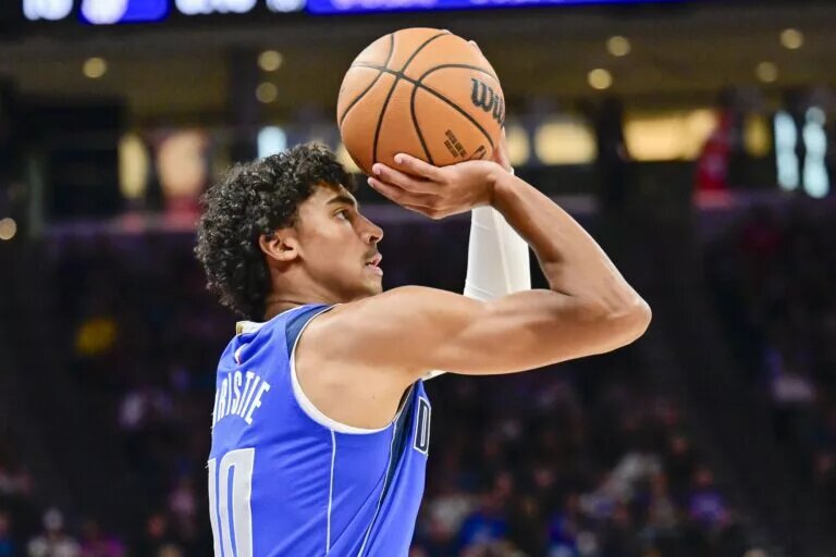 Oct 13, 2025; Salt Lake City, Utah, USA; Dallas Mavericks guard Max Christie (00) takes a three-point shot during the first quarter against the Utah Jazz at Delta Center. Mandatory Credit: Peter Creveling-Imagn Images