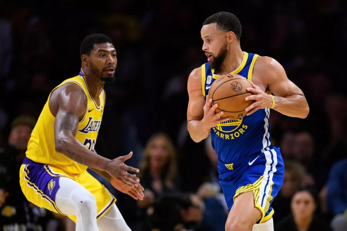 Oct 21, 2025; Los Angeles, California, USA; Golden State Warriors guard Stephen Curry (30) drives past Los Angeles Lakers guard Marcus Smart (36) during the first half at Crypto.com Arena. Mandatory Credit: William Liang-Imagn Images