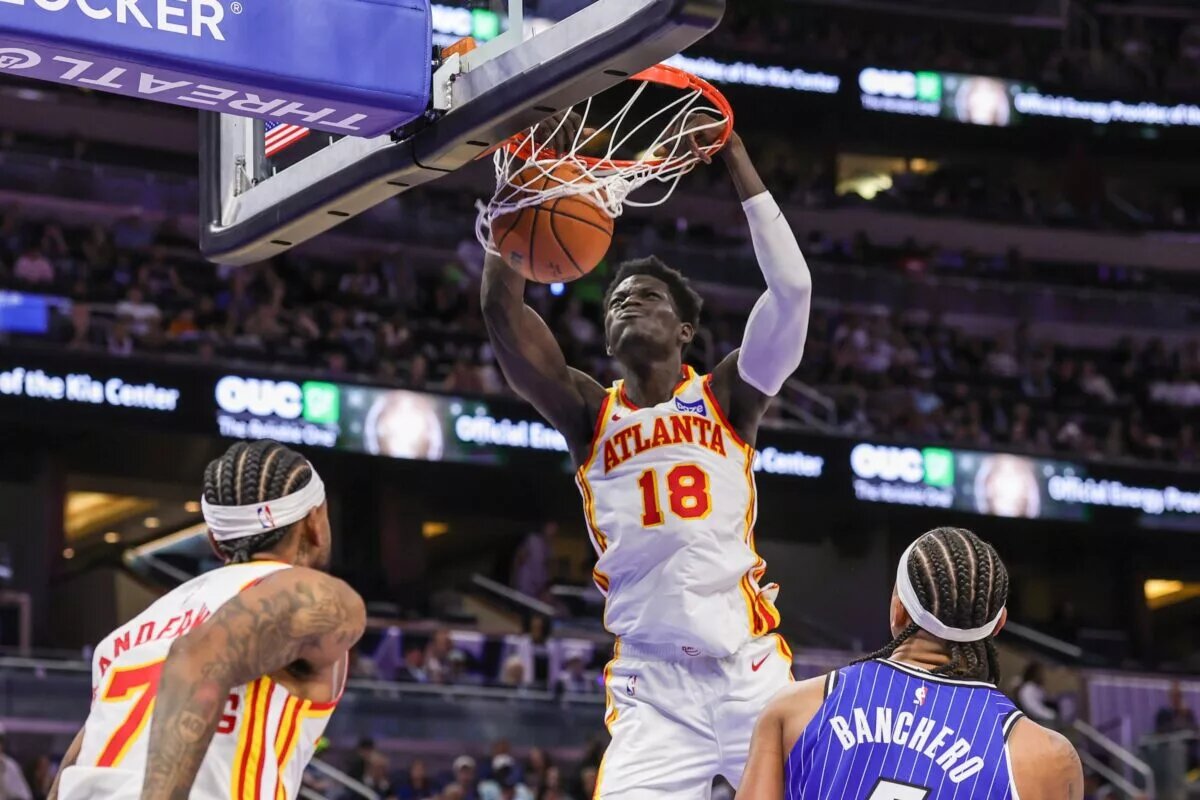 Oct 24, 2025; Orlando, Florida, USA; Atlanta Hawks forward Mouhamed Gueye (18) dunks during the second quarter against the Orlando Magic at Kia Center. Mandatory Credit: Mike Watters-Imagn Images