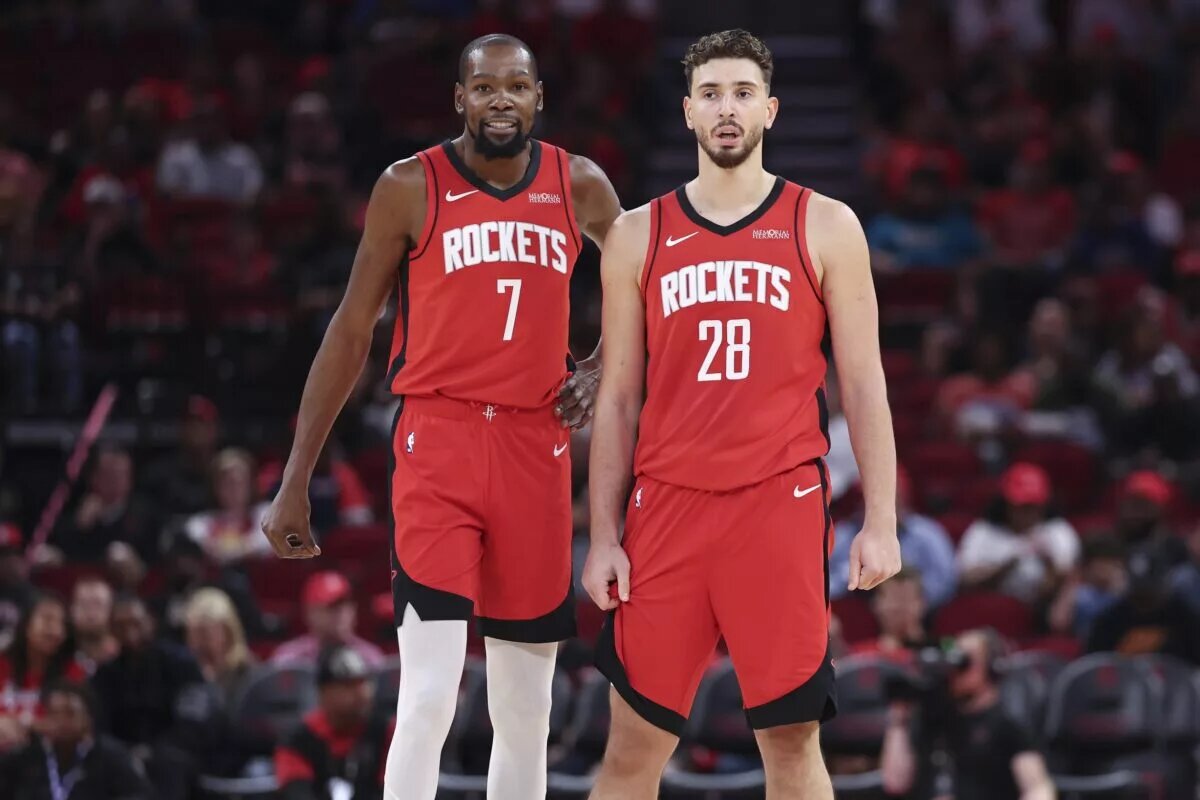 Oct 24, 2025; Houston, Texas, USA; Houston Rockets forward Kevin Durant (7) and center Alperen Sengun (28) stand on the court during the first quarter against the Detroit Pistons at Toyota Center. Mandatory Credit: Troy Taormina-Imagn Images