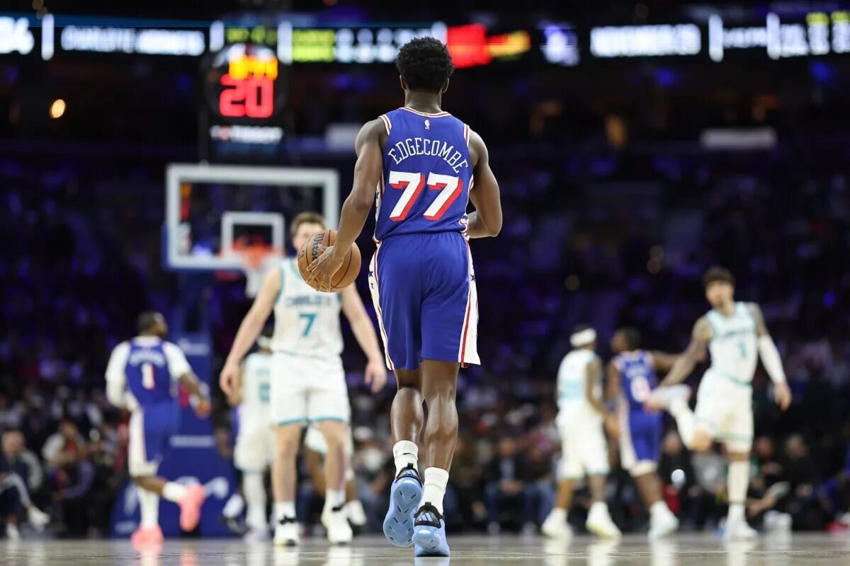 Philadelphia 76ers guard VJ Edgecombe (77) dribbles up court against the Charlotte Hornets during the fourth quarter at Xfinity Mobile Arena.