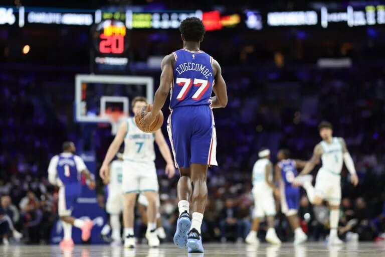 Philadelphia 76ers guard VJ Edgecombe (77) dribbles up court against the Charlotte Hornets during the fourth quarter at Xfinity Mobile Arena.