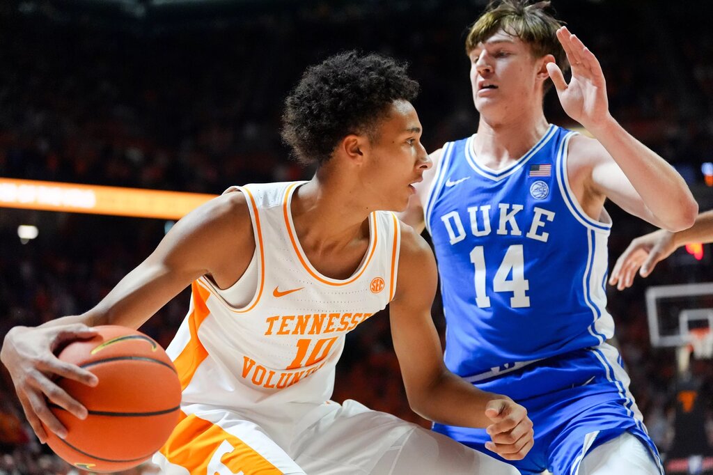 Tennessee forward Nate Ament (10) moves the ball while guarded by Duke guard/forward Nikolas Khamenia (14) during a college basketball exhibition game on October 26, 2025, in Knoxville, Tenn.
