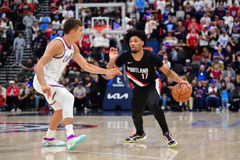 Oct 26, 2025; Inglewood, California, USA; Portland Trail Blazers guard Shaedon Sharpe (17) moves the ball against Los Angeles Clippers guard Bogdan Bogdanovic (10) during the second half at Intuit Dome. Mandatory Credit: Gary A. Vasquez-Imagn Images