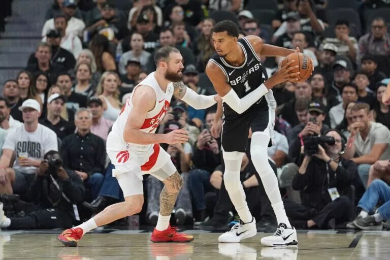 Oct 27, 2025; San Antonio, Texas, USA; San Antonio Spurs forward/center Victor Wembanyama (1) faces off against Toronto Raptors forward/center Sandro Mamukelashvili (54) in the first half at Frost Bank Center. Mandatory Credit: Daniel Dunn-Imagn Images