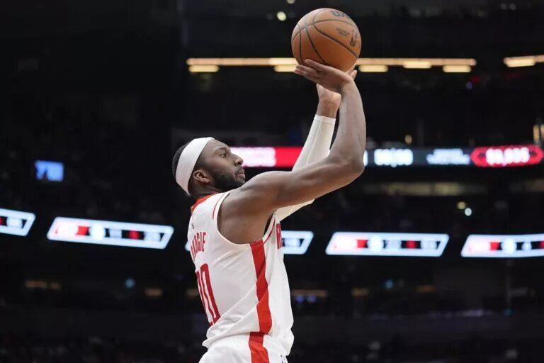 Oct 29, 2025; Toronto, Ontario, CAN; Houston Rockets forward Josh Okogie (20) goes to shoot a three point basket against the Toronto Raptors during the second half at Scotiabank Arena. Mandatory Credit: John E. Sokolowski-Imagn Images