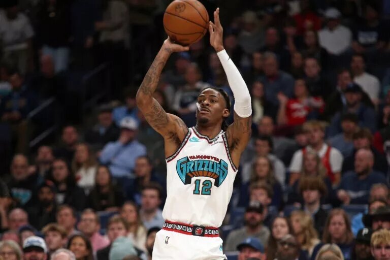 Dec 23, 2024; Memphis, Tennessee, USA; Memphis Grizzlies guard Ja Morant (12) shoots for three during the first quarter against the Los Angeles Clippers at FedExForum. Mandatory Credit: Petre Thomas-Imagn Images