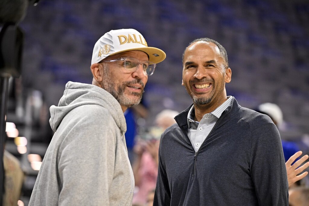 Oct 6, 2025; Fort Worth, Texas, USA; Dallas Mavericks head coach Jason Kidd (left) and general manager Nico Harrison (right) look on before the game against the Oklahoma City Thunder at Dickie's Arena. Mandatory Credit: Jerome Miron-Imagn Images