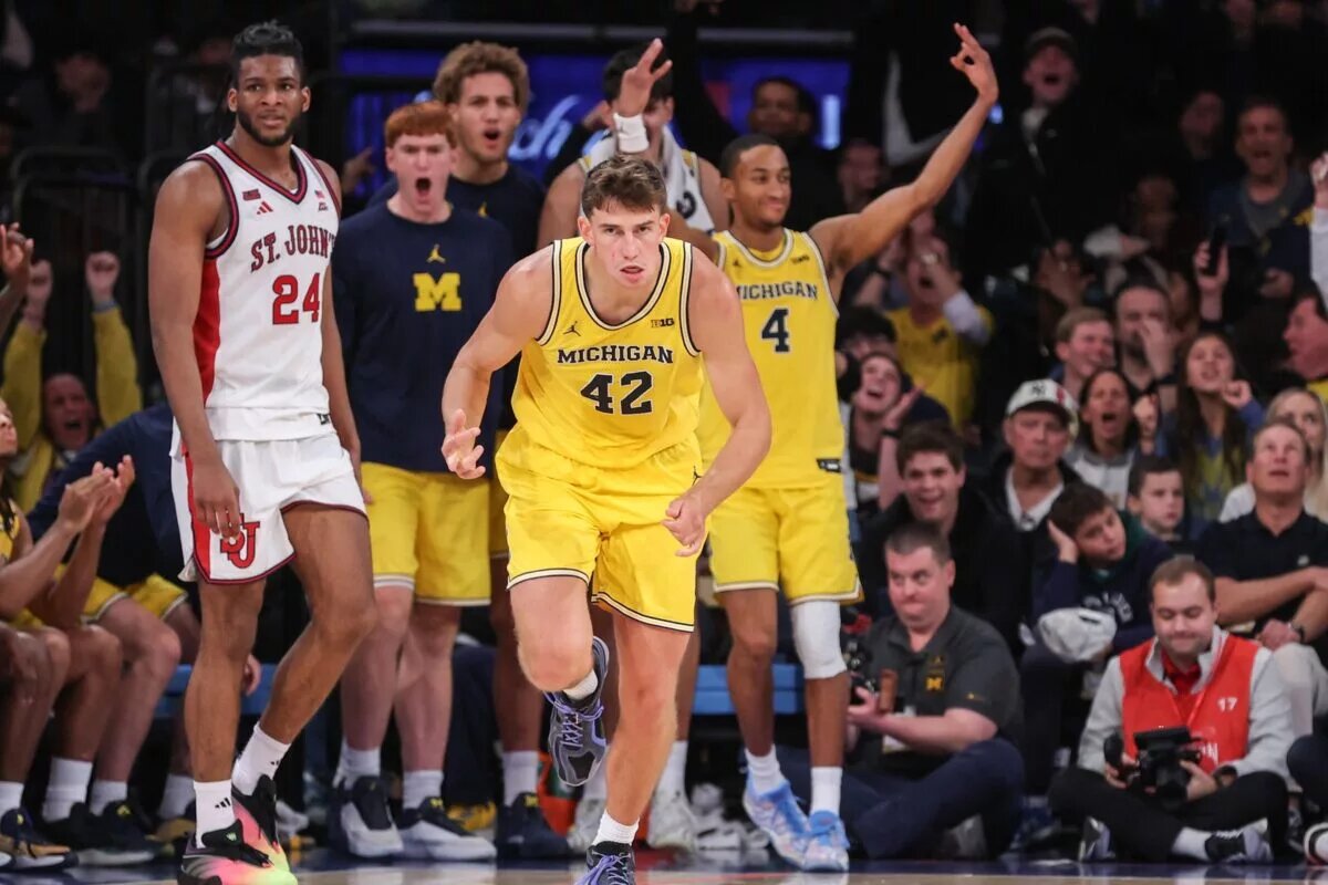 Oct 25, 2025; New York, NY, USA; Michigan Wolverines forward Will Tschetter (42) celebrates after making a three point shot in overtime against the St. John's Red Storm at Madison Square Garden. Mandatory Credit: Wendell Cruz-Imagn Images