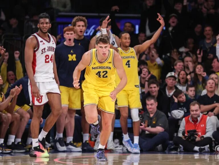 Oct 25, 2025; New York, NY, USA; Michigan Wolverines forward Will Tschetter (42) celebrates after making a three point shot in overtime against the St. John's Red Storm at Madison Square Garden. Mandatory Credit: Wendell Cruz-Imagn Images
