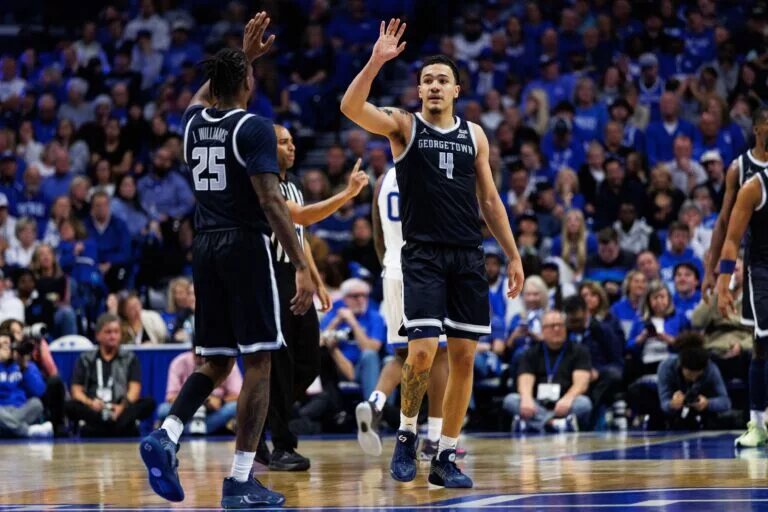 Oct 30, 2025; Lexington, KY, USA; Georgetown Hoyas forward Caleb Williams (4) celebrates with guard Jeremiah Williams (25) during the second half against the Kentucky Wildcats at Rupp Arena at Central Bank Center. Mandatory Credit: Jordan Prather-Imagn Images