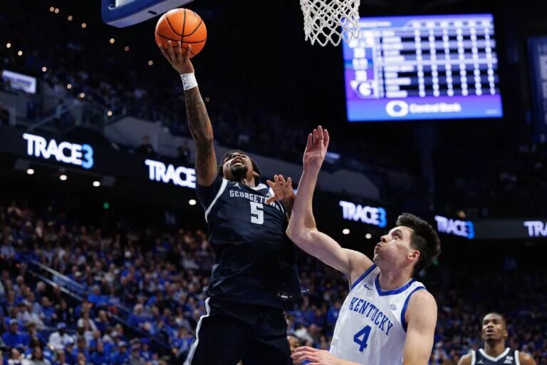 Georgetown Hoyas guard Kj Lewis (5) goes to the basket against Kentucky Wildcats forward Andrija Jelavic (4) during the first half at Rupp Arena at Central Bank Center.