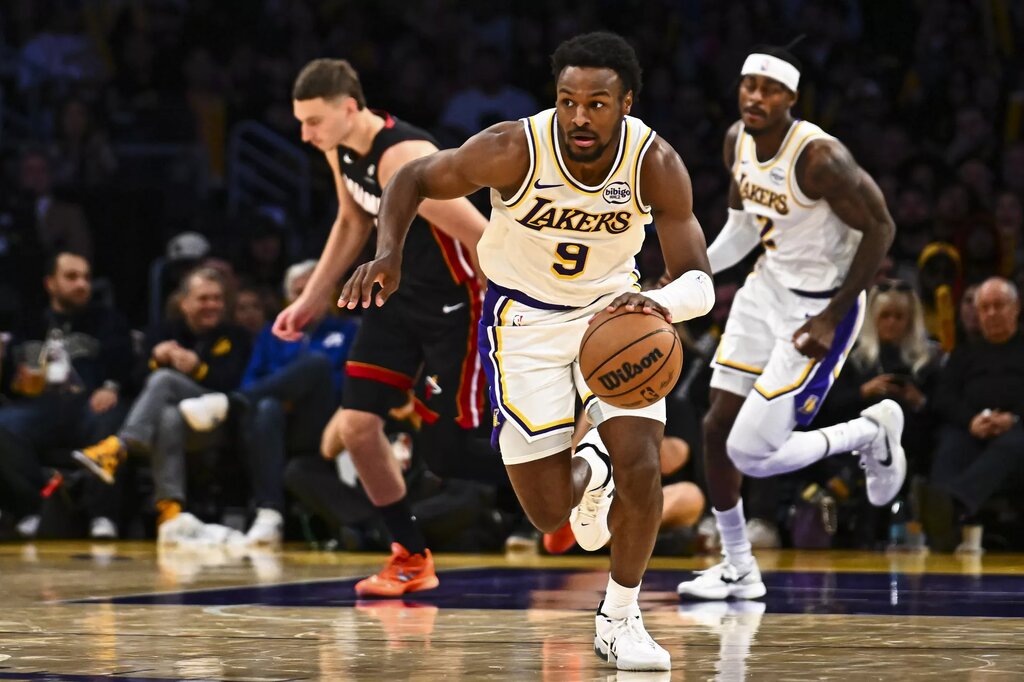 Nov 2, 2025; Los Angeles, California, USA; Los Angeles Lakers guard Bronny James (9) charges the net against the Miami Heat during the second half at Crypto.com Arena. Mandatory Credit: Jonathan Hui-Imagn Images