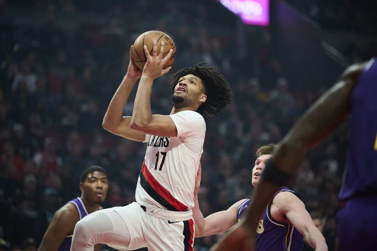 Nov 3, 2025; Portland, Oregon, USA; Portland Trail Blazers guard Shaedon Sharpe (17) scores a basket during the first half against the Los Angeles Lakers at Moda Center. Mandatory Credit: Troy Wayrynen-Imagn Images