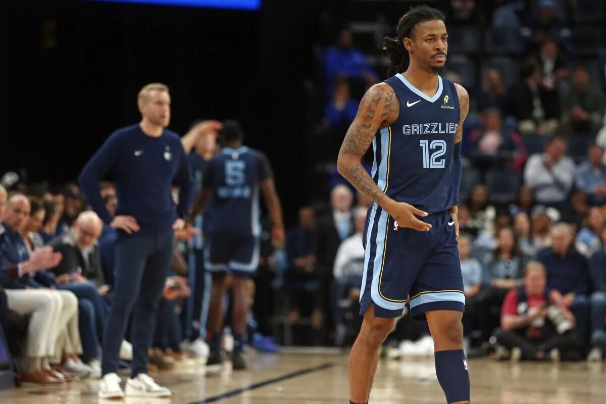 Nov 3, 2025; Memphis, Tennessee, USA; Memphis Grizzlies guard Ja Morant (12) checks into the game during the second quarter against the Detroit Pistons at FedExForum. Mandatory Credit: Petre Thomas-Imagn Images