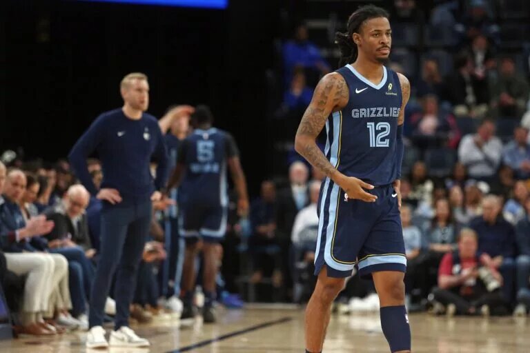 Nov 3, 2025; Memphis, Tennessee, USA; Memphis Grizzlies guard Ja Morant (12) checks into the game during the second quarter against the Detroit Pistons at FedExForum. Mandatory Credit: Petre Thomas-Imagn Images