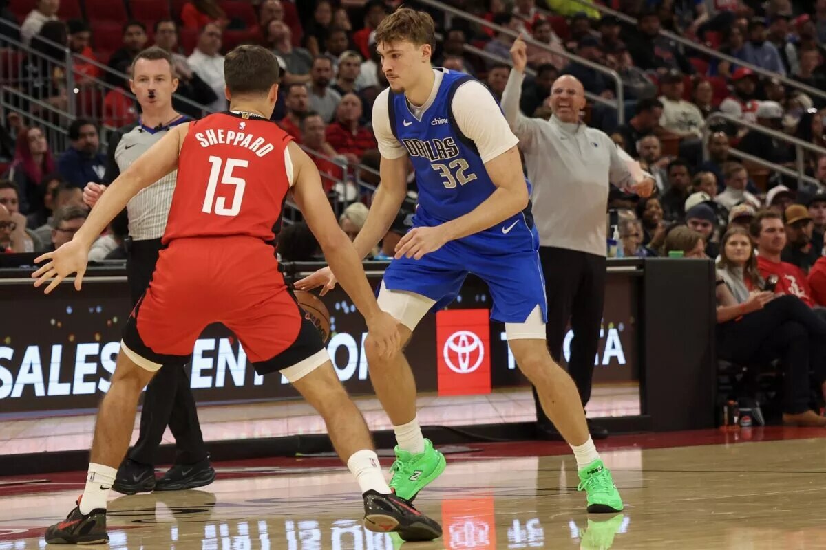 Dallas Mavericks forward Cooper Flagg (32) dribbles against Houston Rockets guard Reed Sheppard (15) in the third quarter at Toyota Center.