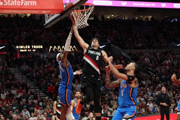 Nov 5, 2025; Portland, Oregon, USA; Portland Trail Blazers forward Deni Avdija (8) dunks the ball over Oklahoma City Thunder guard Shai Gilgeous-Alexander (2) and Thunder’s forward Jaylin Williams (6) during the second half at Moda Center. Mandatory Credit: Jaime Valdez-Imagn Images