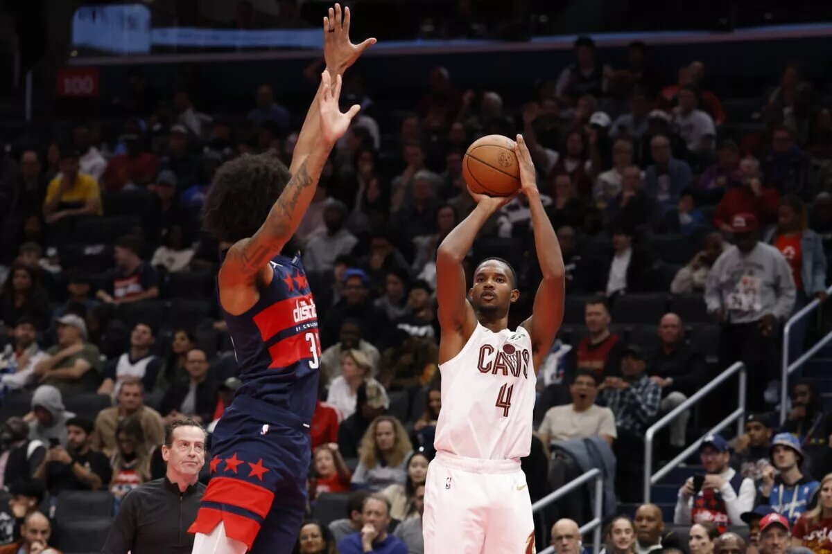 Nov 7, 2025; Washington, District of Columbia, USA; Cleveland Cavaliers center Evan Mobley (4)shoots the ball as Washington Wizards forward Marvin Bagley III (35) defends in the second half in an Emirates NBA Cup game at Capital One Arena. Mandatory Credit: Geoff Burke-Imagn Images
