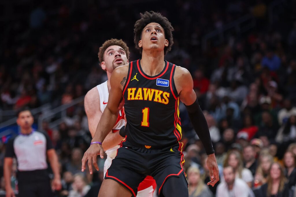 Atlanta Hawks forward Jalen Johnson (1) boxes out Toronto Raptors forward Jamison Battle (77) in the fourth quarter at State Farm Arena. 