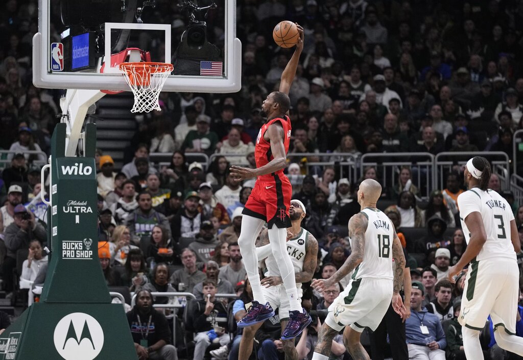 Nov 9, 2025; Milwaukee, Wisconsin, USA; Houston Rockets forward Kevin Durant (7) dunks the ball against Milwaukee Bucks guard Gary Trent Jr. (5) in the second half at Fiserv Forum. Mandatory Credit: Michael McLoone-Imagn Images