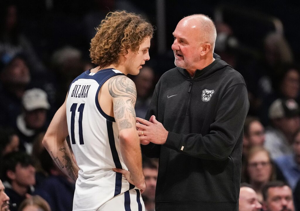 Butler Bulldogs guard Finley Bizjack (11) talks with Butler Bulldogs head coach Thad Matta on Tuesday, Nov. 11, 2025, during the game at Hinkle Fieldhouse in Indianapolis.