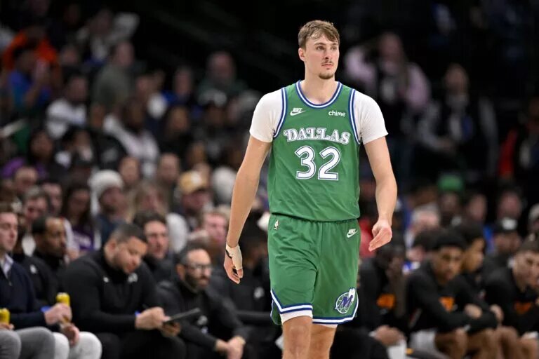 Dallas Mavericks forward Cooper Flagg (32) walks back up the court during the second half against the Phoenix Suns at the American Airlines Center.