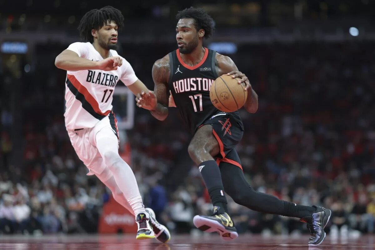 Houston Rockets forward Tari Eason (17) drives with the ball as Portland Trail Blazers guard Shaedon Sharpe (17) defends during the second quarter at Toyota Center.