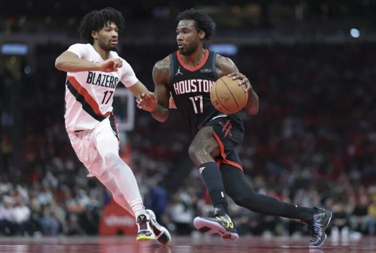 Houston Rockets forward Tari Eason (17) drives with the ball as Portland Trail Blazers guard Shaedon Sharpe (17) defends during the second quarter at Toyota Center.