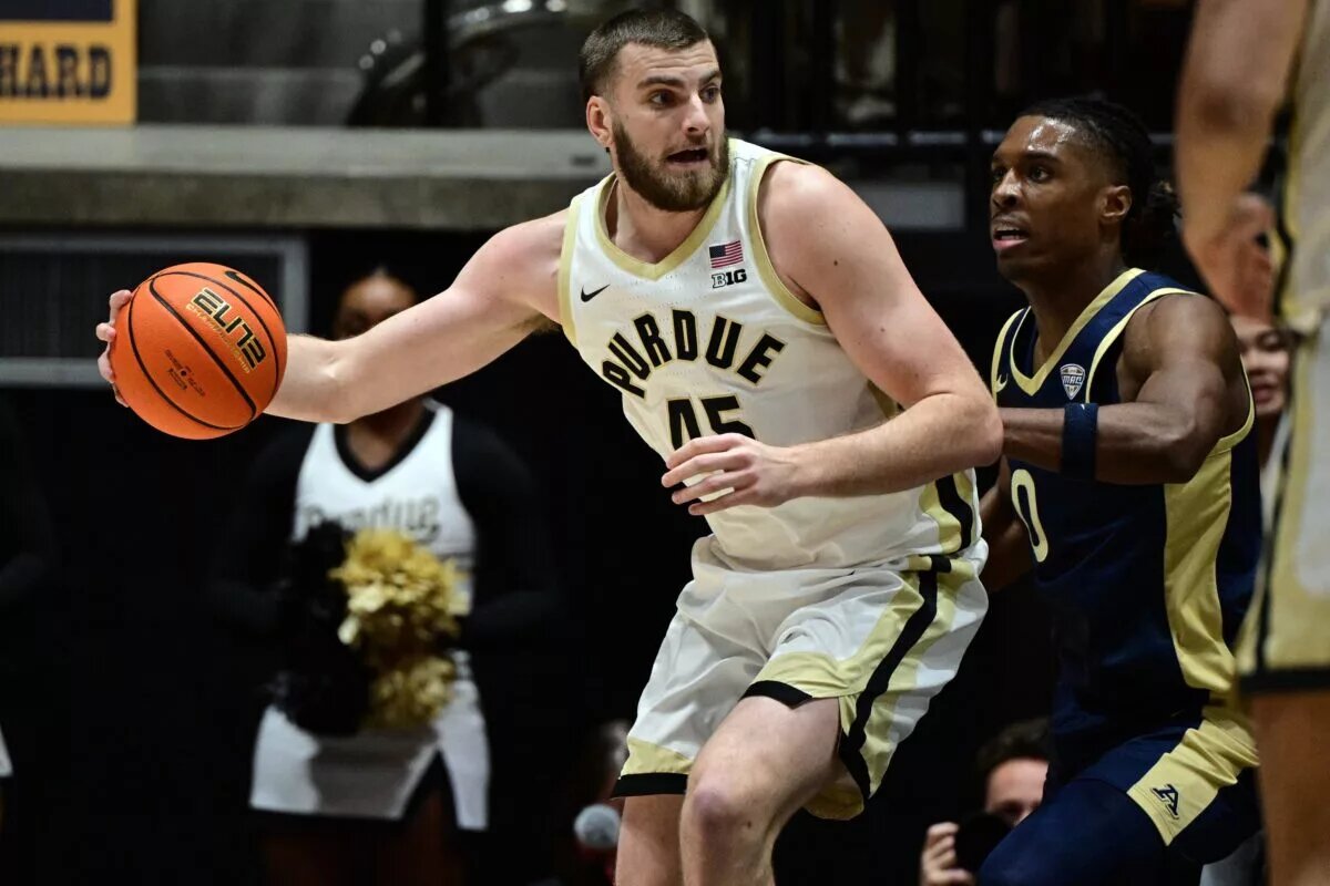 Purdue Boilermakers center Oscar Cluff (45) leans in against Akron Zips forward Amani Lyles (0) during the first half at Mackey Arena.