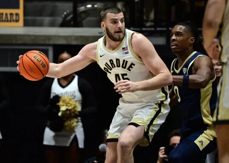 Purdue Boilermakers center Oscar Cluff (45) leans in against Akron Zips forward Amani Lyles (0) during the first half at Mackey Arena.