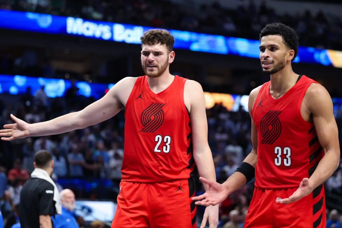 Nov 16, 2025; Dallas, Texas, USA; Portland Trail Blazers center Donovan Clingan (23) and Portland Trail Blazers forward Toumani Camara (33) react against the Dallas Mavericks in overtime at American Airlines Center. Mandatory Credit: Kevin Jairaj-Imagn Images