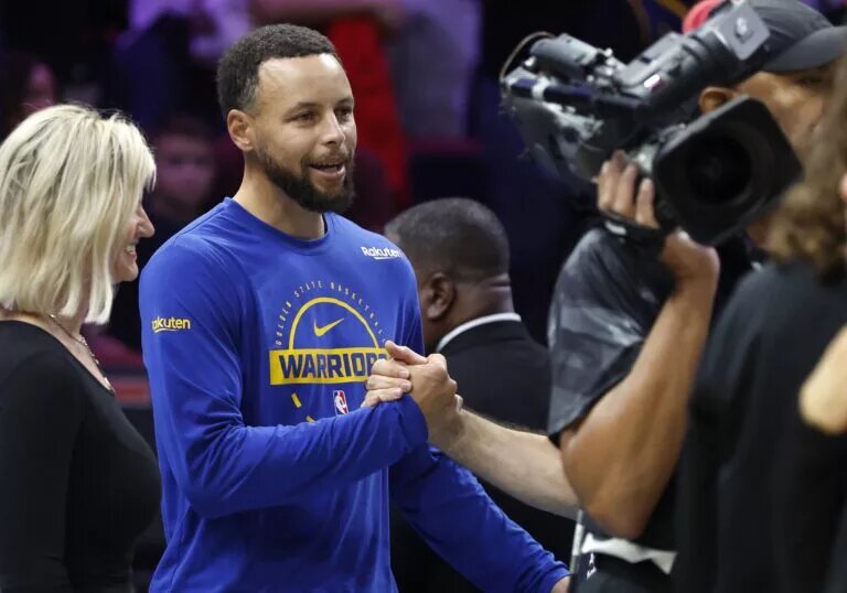 Golden State Warriors guard Stephen Curry (30) greets fans before the game against the Miami Heat at Kaseya Center.