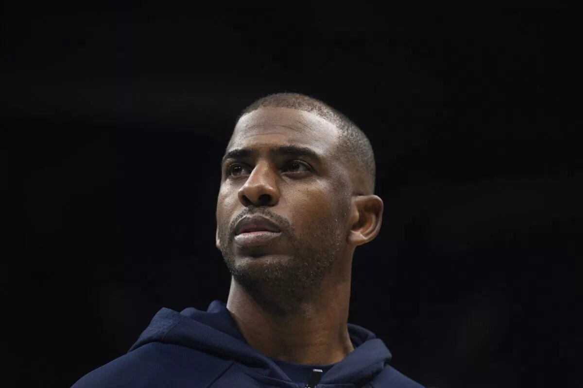 Nov 22, 2025; Charlotte, North Carolina, USA; Los Angeles Clippers guard Chris Paul (3) in a time out during the first half against the Charlotte Hornets at the Spectrum Center. Mandatory Credit: Sam Sharpe-Imagn Images