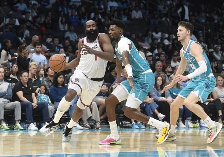 Nov 22, 2025; Charlotte, North Carolina, USA; Los Angeles Clippers guard James Harden (1) drives in past Charlotte Hornets guard Brandon Miller (24) during the second half at the Spectrum Center. Mandatory Credit: Sam Sharpe-Imagn Images