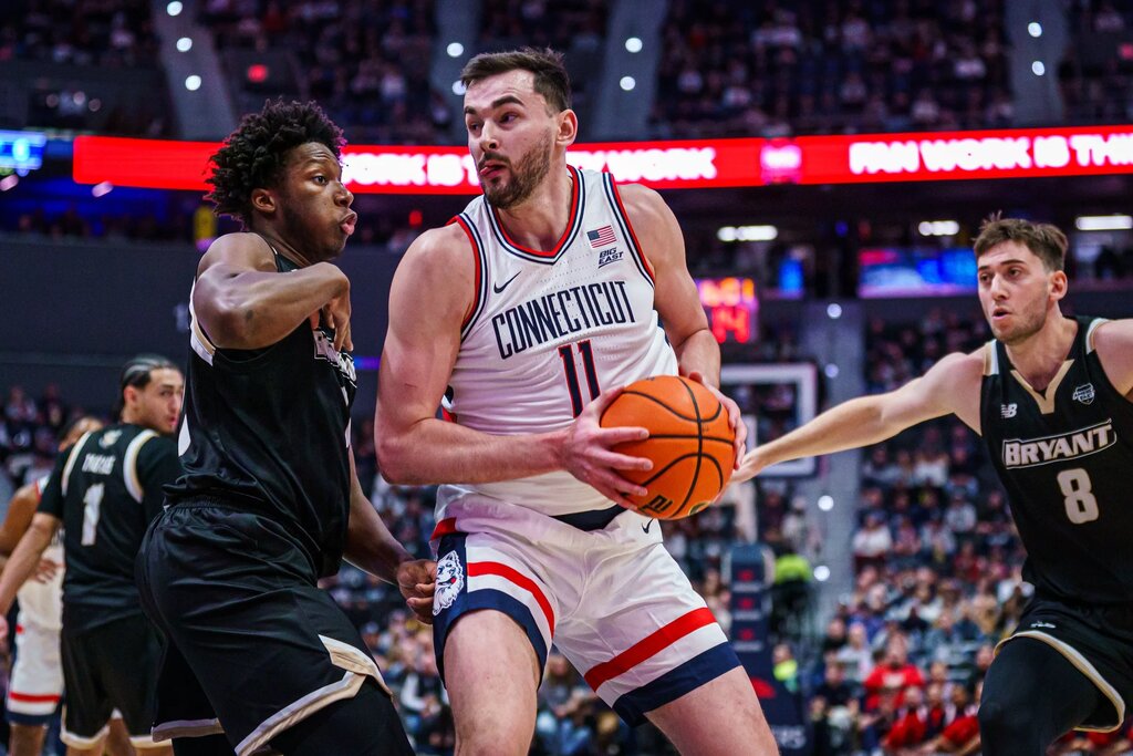 UConn Huskies forward Alex Karaban (11) drives the ball against the Bryant Bulldogs in the first half at Peoples Bank Arena.