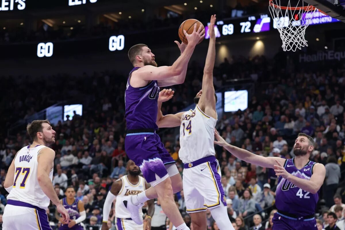 Nov 23, 2025; Salt Lake City, Utah, USA; Utah Jazz guard Svi Mykhailiuk (10) goes to the basket against Los Angeles Lakers forward Maxi Kleber (14) during the second half at Delta Center. Mandatory Credit: Rob Gray-Imagn Images