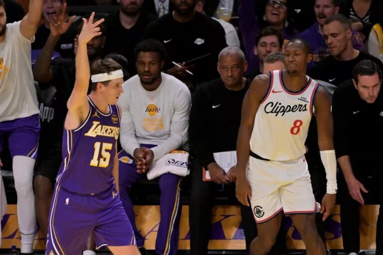 Nov 25, 2025; Los Angeles, California, USA; Los Angeles Lakers guard Austin Reaves (15) reacts after a 3-point basket in the second half against the Los Angeles Clippers at Crypto.com Arena. Mandatory Credit: Jayne Kamin-Oncea-Imagn Images