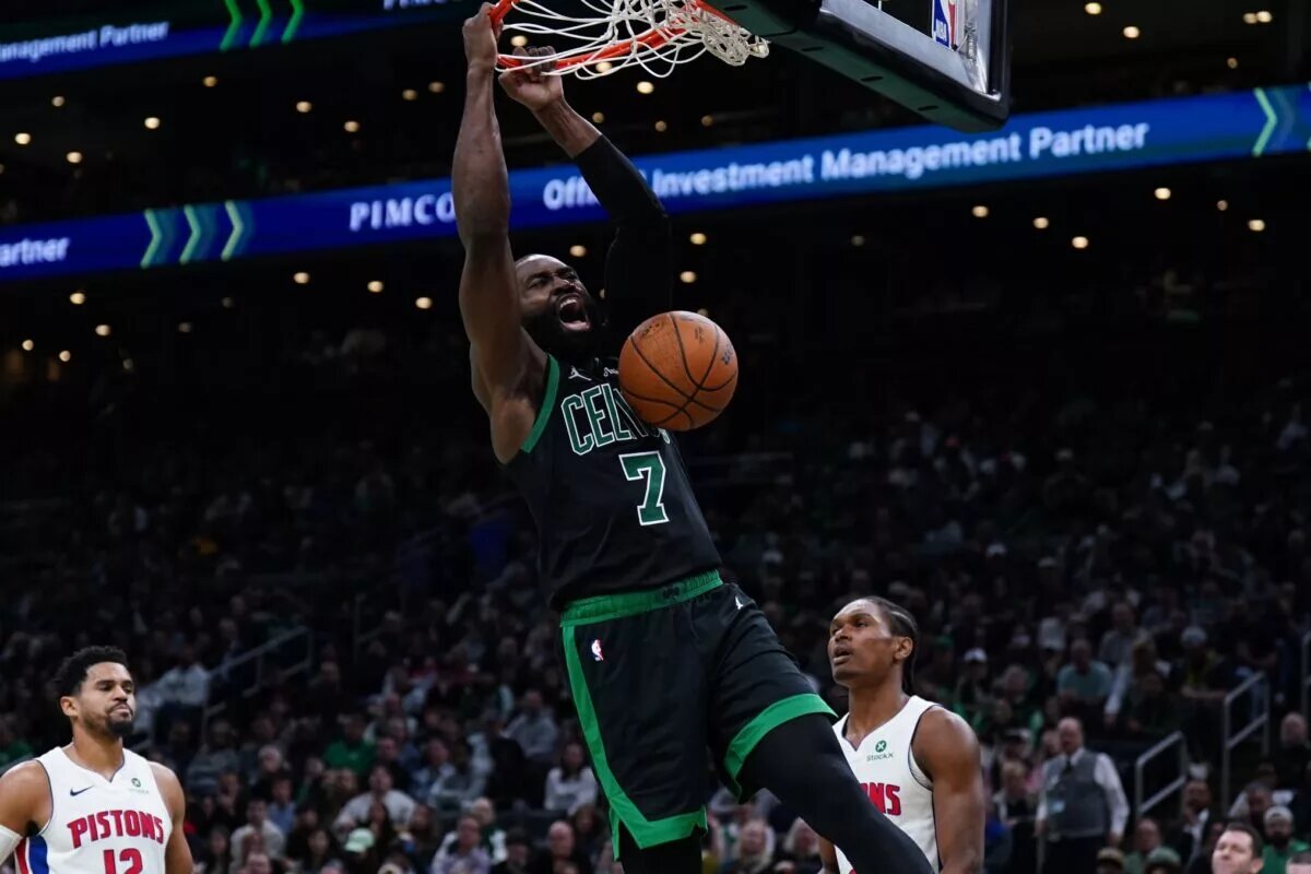 Boston Celtics guard Jaylen Brown (7) makes the basket against the Detroit Pistons in the second half at TD Garden.