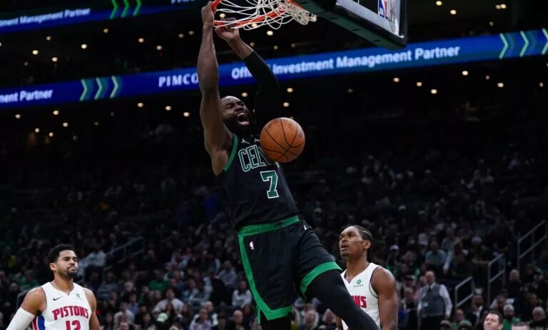 Boston Celtics guard Jaylen Brown (7) makes the basket against the Detroit Pistons in the second half at TD Garden.