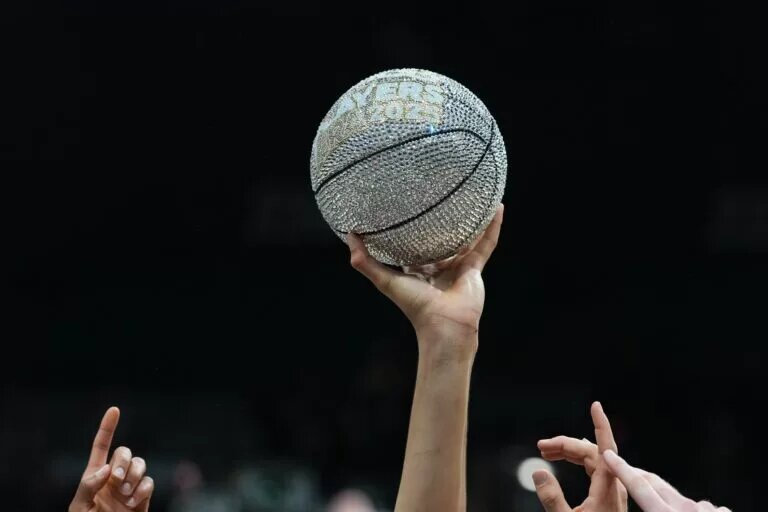 Nov 26, 2025; Las Vegas, NV, USA; A detailed view of the 2025 Players Era Festival trophy lifted up by members of Michigan Wolverines after the championship game against the Gonzaga Bulldogs at MGM Grand Garden Arena. Mandatory Credit: Kirby Lee-Imagn Images