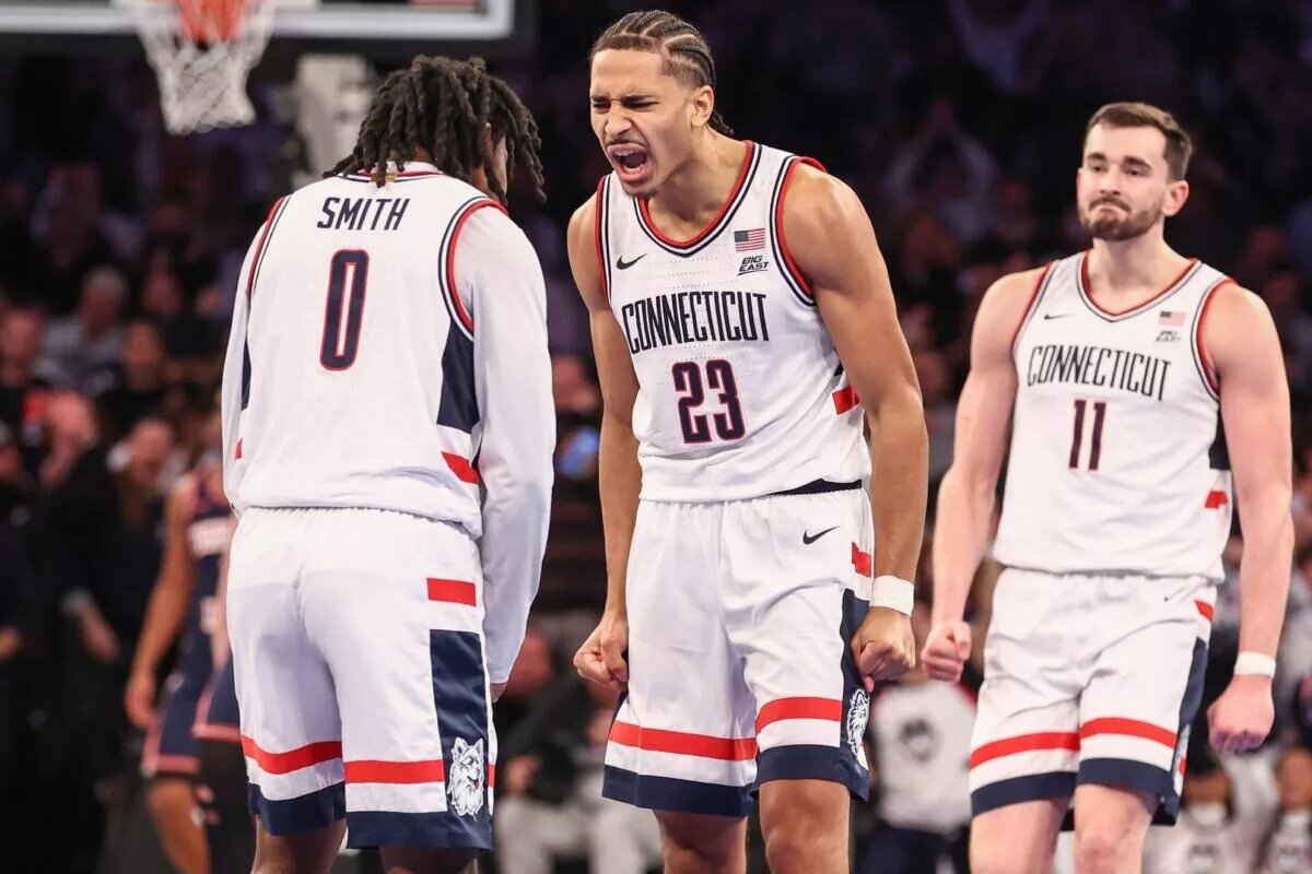UConn Huskies forward Jayden Ross (23) celebrates with guard Malachi Smith (0) in the second half against the Illinois Fighting Illini at Madison Square Garden.