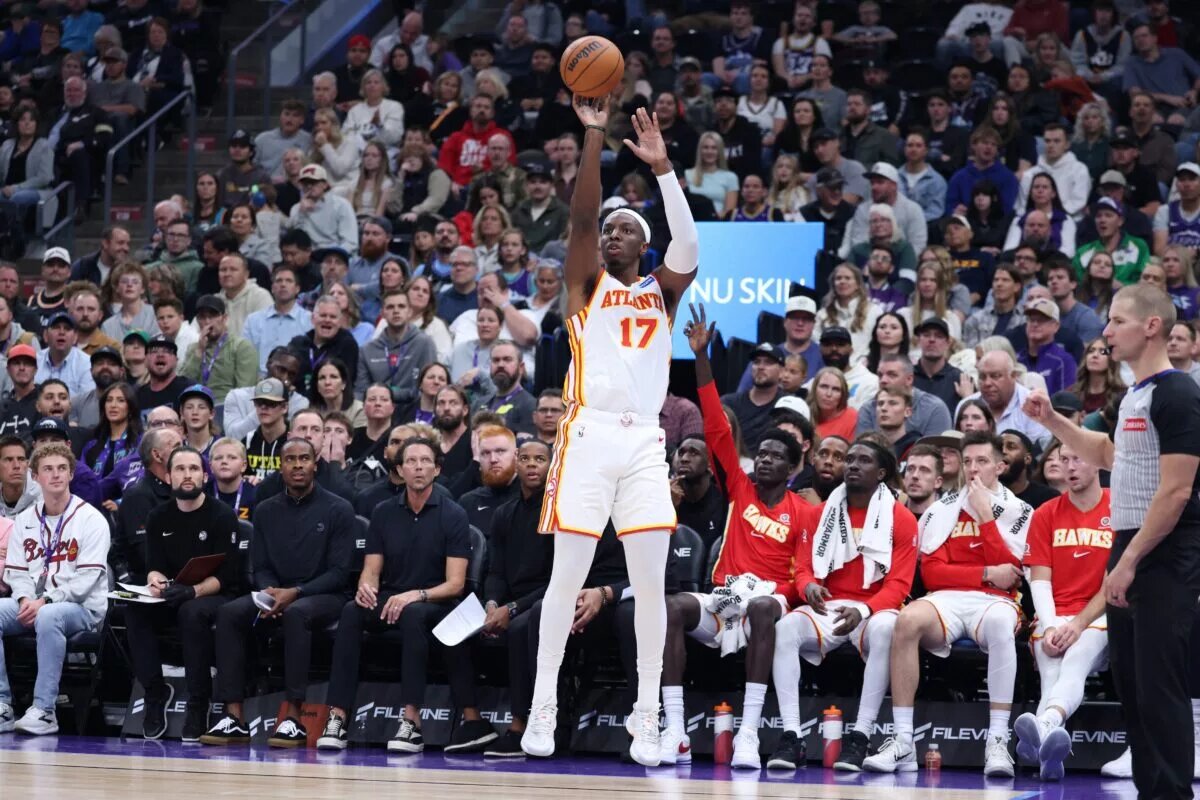 Nov 13, 2025; Salt Lake City, Utah, USA; Atlanta Hawks forward Onyeka Okongwu (17) makes a three point basket against the Utah Jazz during the second quarter at Delta Center. Mandatory Credit: Rob Gray-Imagn Images