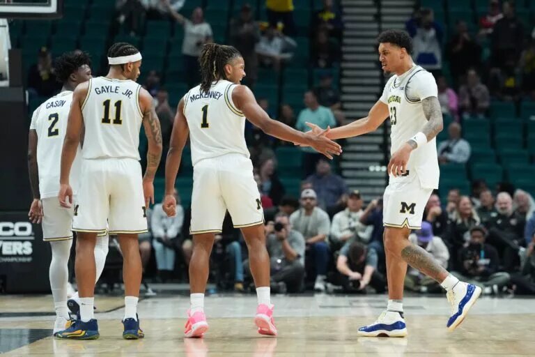 Nov 26, 2025; Las Vegas, NV, USA; Michigan Wolverines guard Trey McKenney (1) celebrates with forward Yaxel Lendeborg (23) in the second half against the Gonzaga Bulldogs in the 2025 Players Era Festival championship game at MGM Grand Garden Arena. Mandatory Credit: Kirby Lee-Imagn Images
