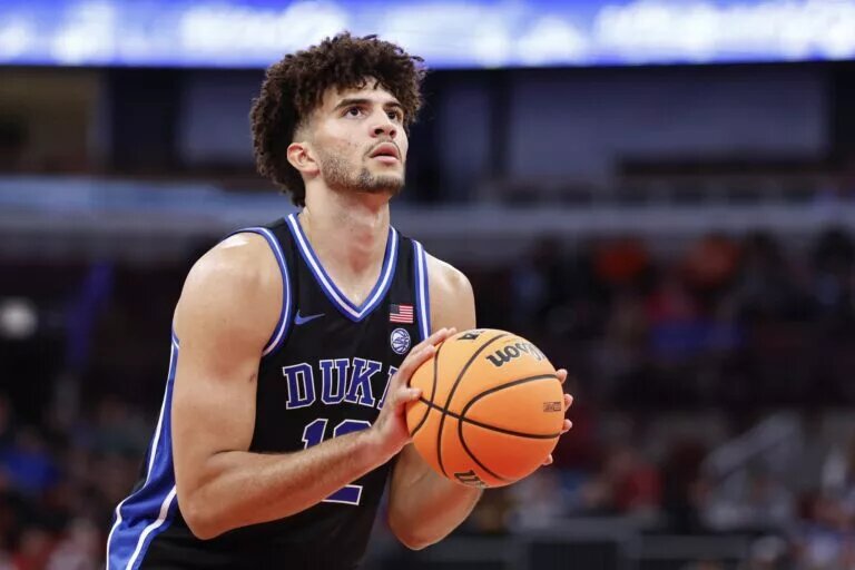 Duke Blue Devils forward Cameron Boozer (12) shoots a free throw against the Arkansas Razorbacks during the second half at United Center.