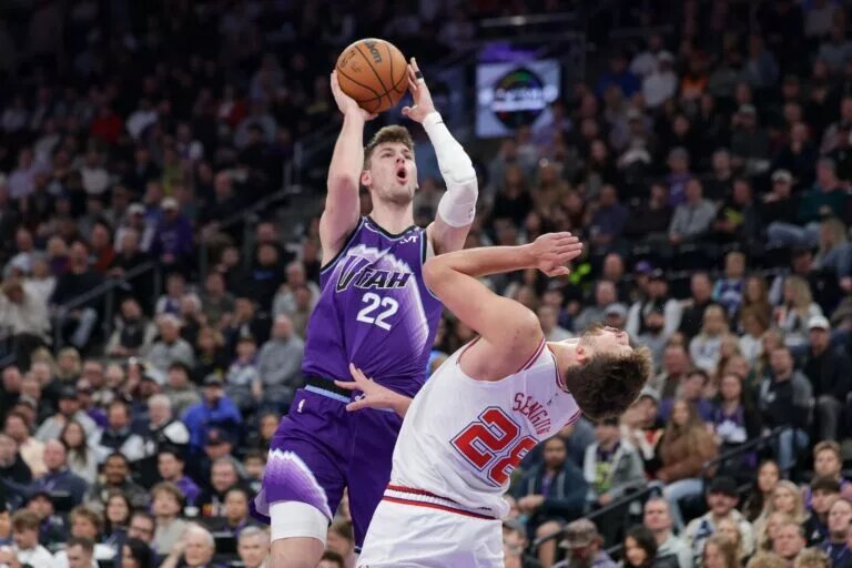 Utah Jazz forward Kyle Filipowski (22) commits a second offensive foul on Houston Rockets center Alperen Sengun (28) during the second quarter at Delta Center.