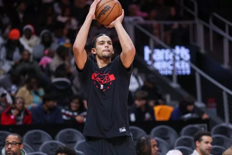 Atlanta Hawks forward Asa Newell (14) warms up before a game against the Denver Nuggets at State Farm Arena.